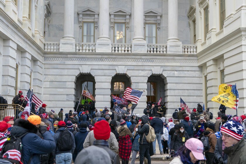 Trump supporters try to open a door at the U.S. Capitol on Jan. 6, 2021. 