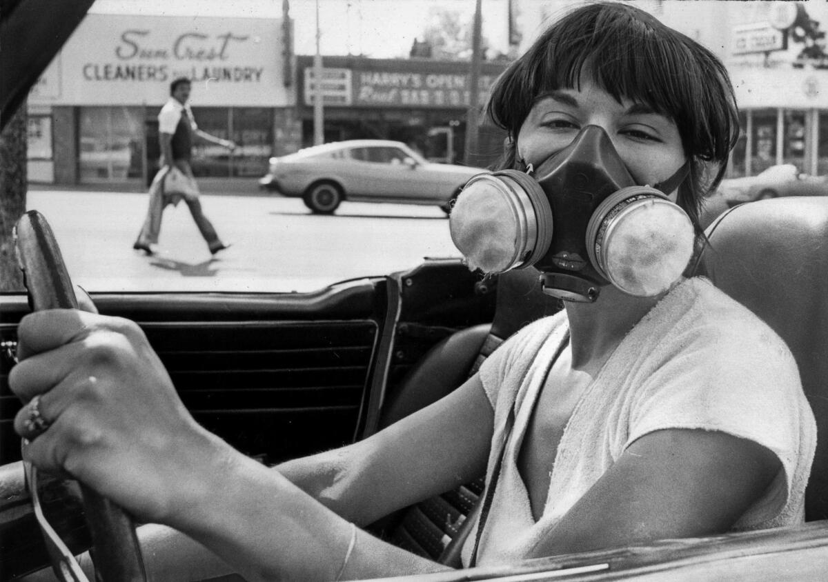 June 29, 1979: Sera Segal-Alsberg wears a mask designed to filter out airborne particles during a Los Angeles smog alert.