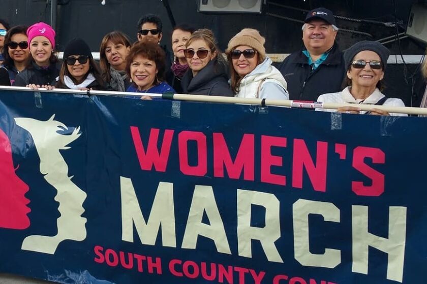 Daniel Hernandez poses with members of MANA and other local organizations at the Women's Worldwide March Jan. 21, 2017