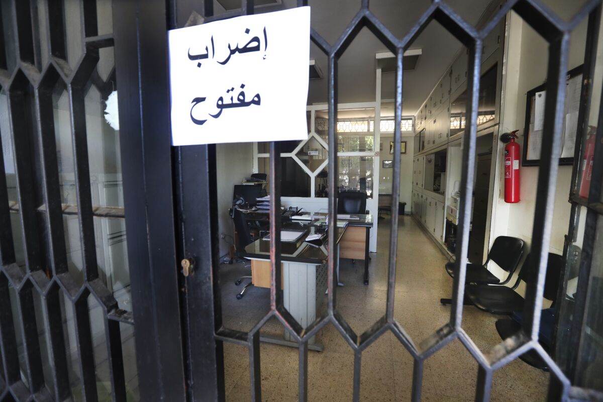 Arabic sign on empty office warning of a strike