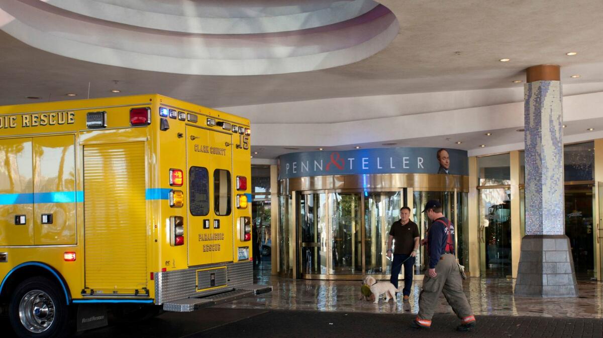 A Clark County firefighter walks past a guest standing outside the Ipanema Tower at the Rio Hotel & Casino after reports of smoke coming from the 21st floor of the Masquerade Tower led to the evacuation of guests Thursday, Dec. 29, 2016.