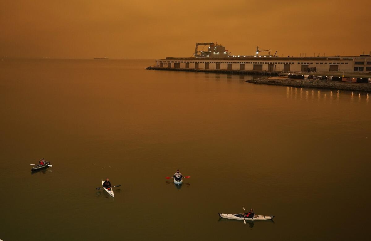 Kayakers paddle in McCovey Cove outside San Francisco's Oracle Park on Wednesday.