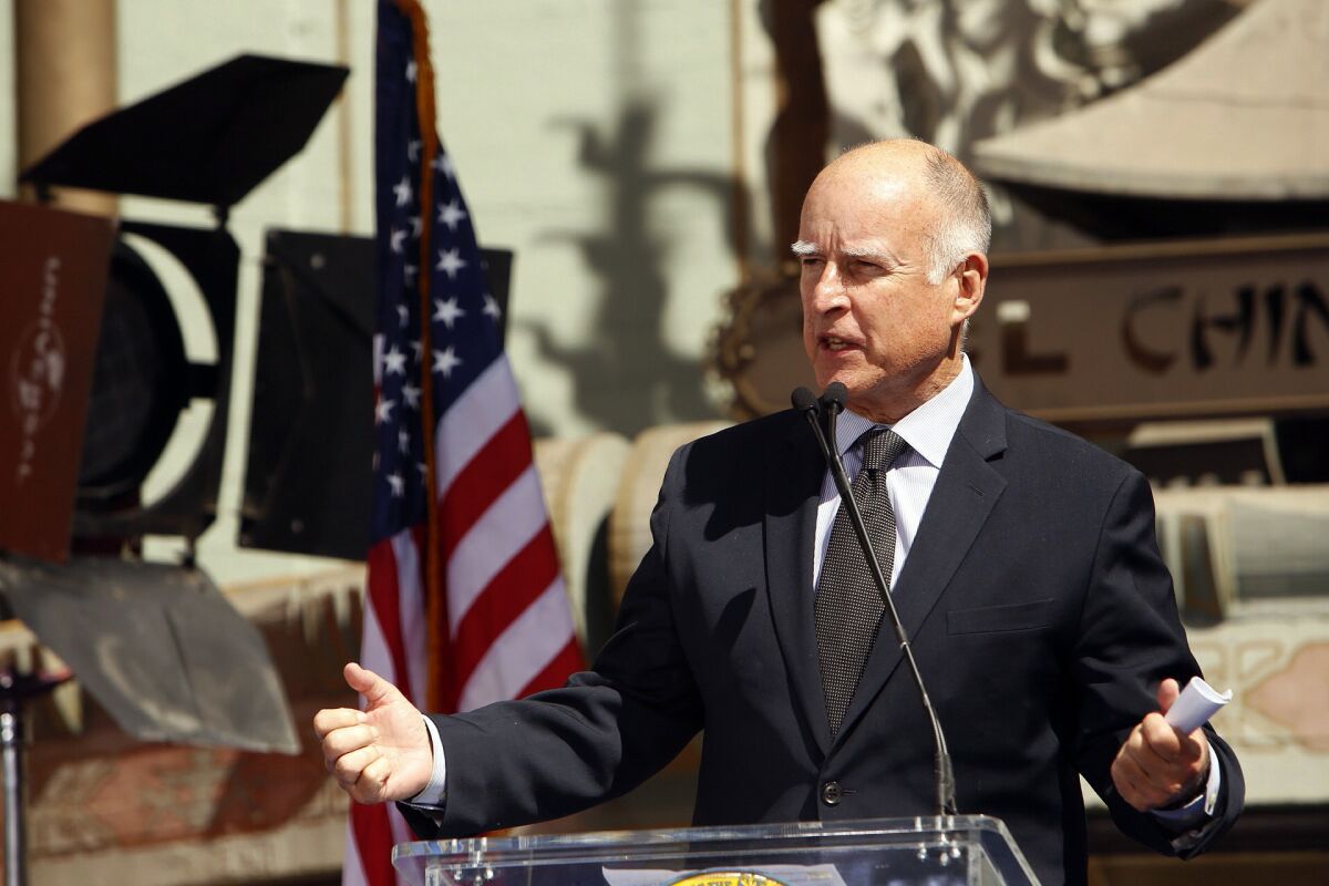 Gov. Jerry Brown speaks before signing the new film tax credit bill in front of TLC Chinese Theatre in Hollywood Sept. 18.