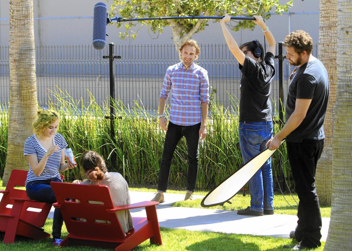 Sara Rubin, left, and Ella Mielniczenko perform for a BuzzFeed Motion Pictures video shot by Andrew Gauthier, sound grip Patrick Ward and lighting assistant Steven Aleck.