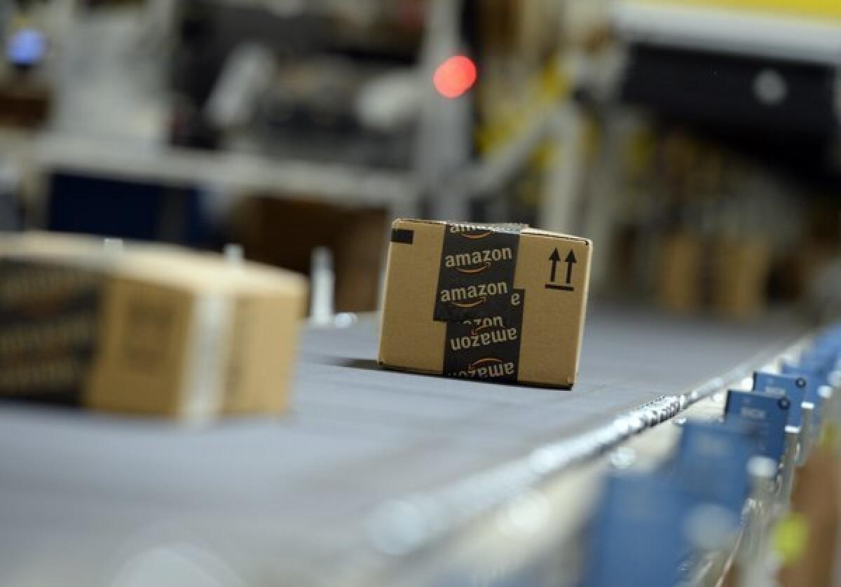 Shipping orders go by on a conveyor belt at Amazon's San Bernardino Fulfillment Center.