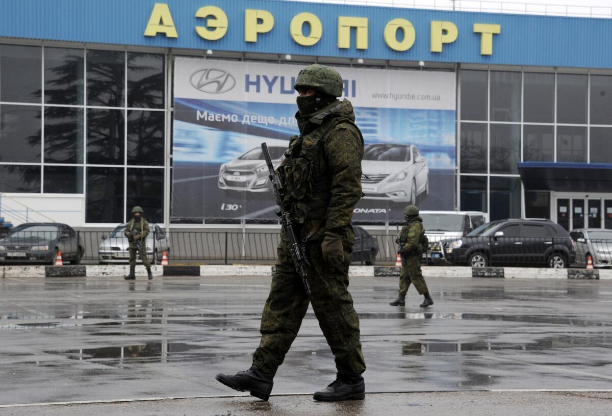 Russian troops seized control of Crimea's civilian international airport in Simferopol in late February, and the Russian government has proclaimed its takeover of air traffic control responsibility, effective Thursday, prompting a warning by the European Aviation Safety Agency of potential risks to civil aviation in the disputed region.