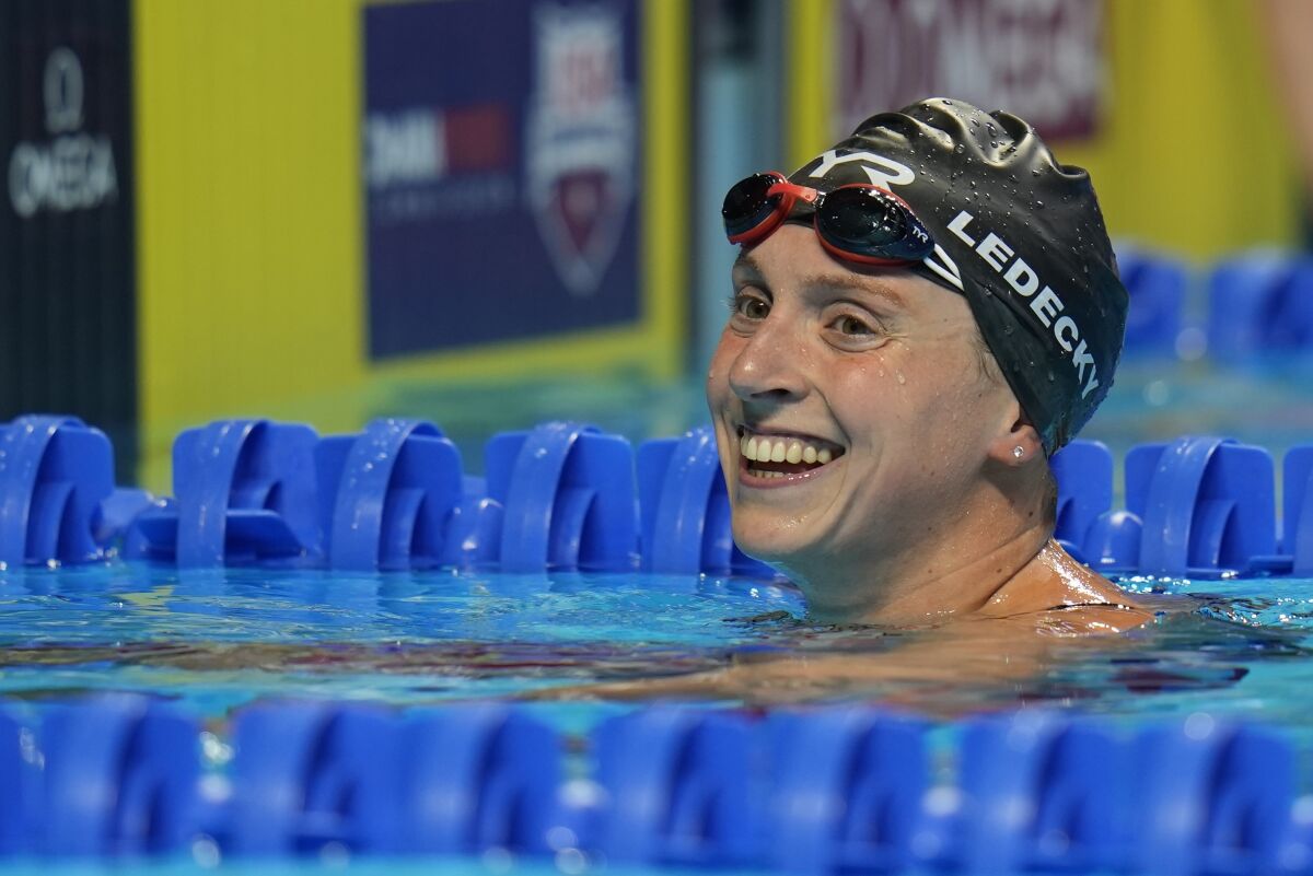 Katie Ledecky smiles after winning the women's 1,500-meter freestyle at the U.S. Olympic swimming trials.