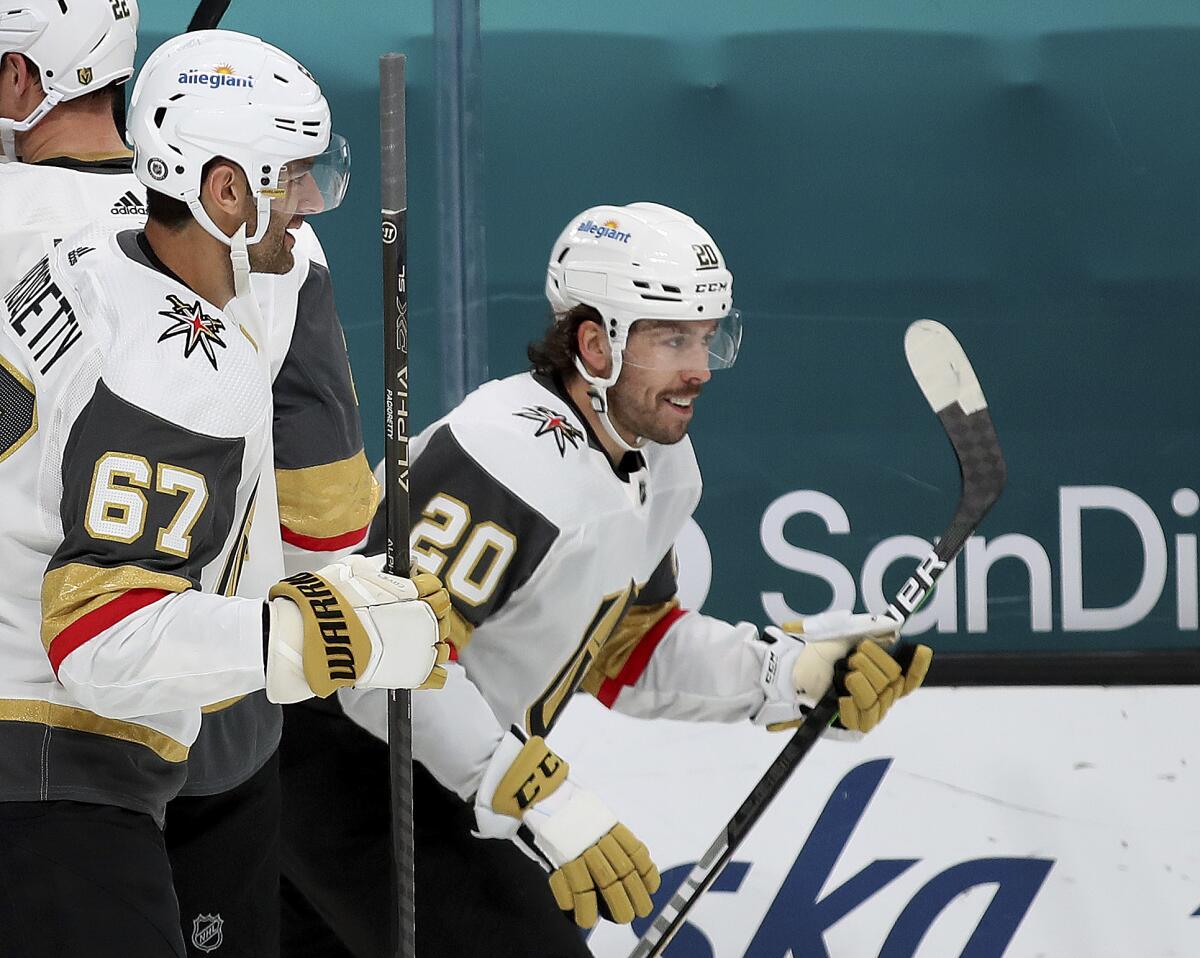 Vegas Golden Knights left wing Max Pacioretty (67) celebrates with center Chandler Stephenson (20), who scored a goal against the San Jose Sharks during the first period of an NHL hockey game in San Jose, Calif., Friday, March 5, 2021. (AP Photo/Josie Lepe)