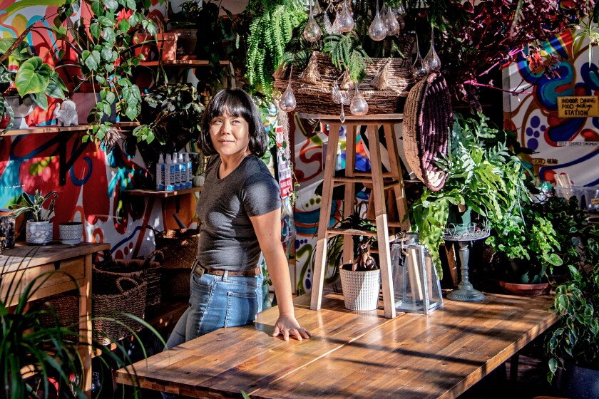 A woman surrounded by plants