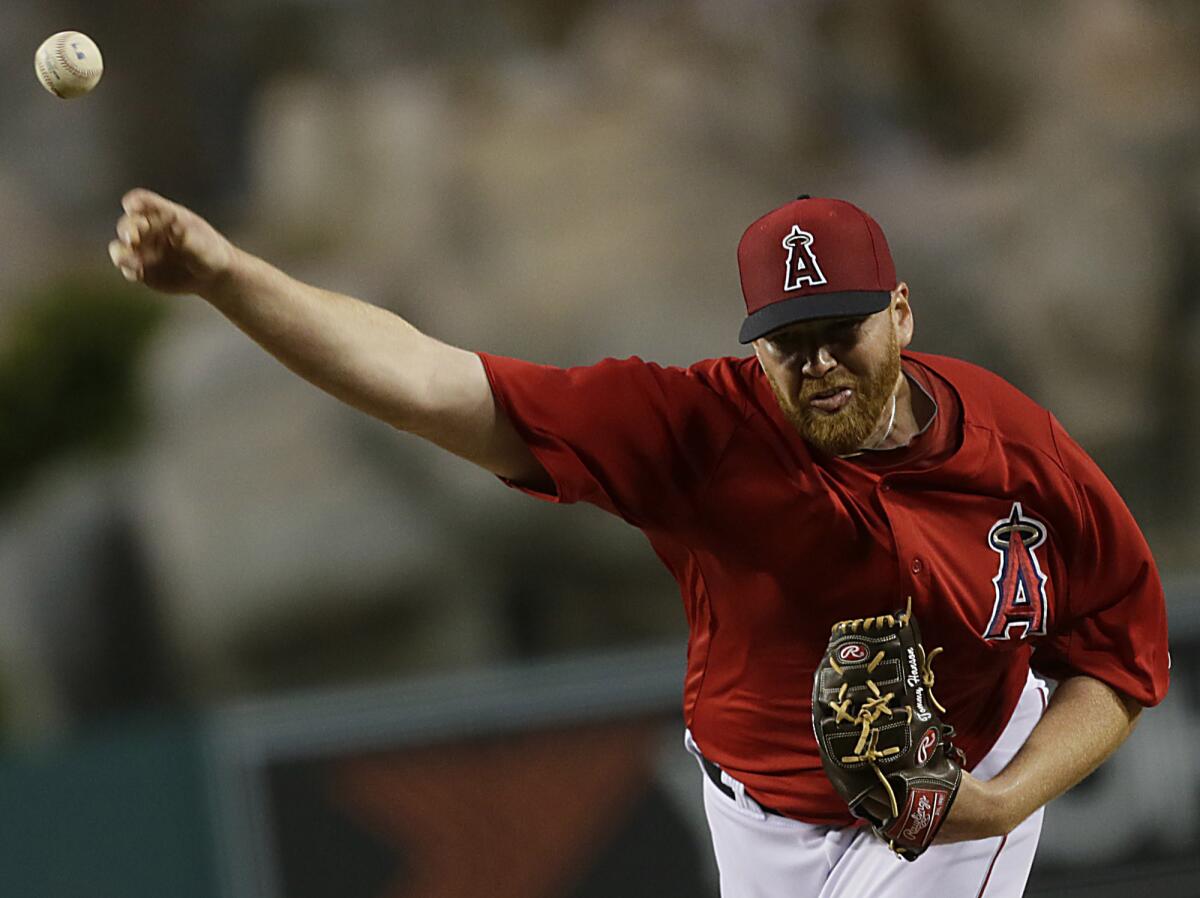 Angels pitcher Tommy Hanson delivers a pitch against the Dodgers on March 30, 2013.