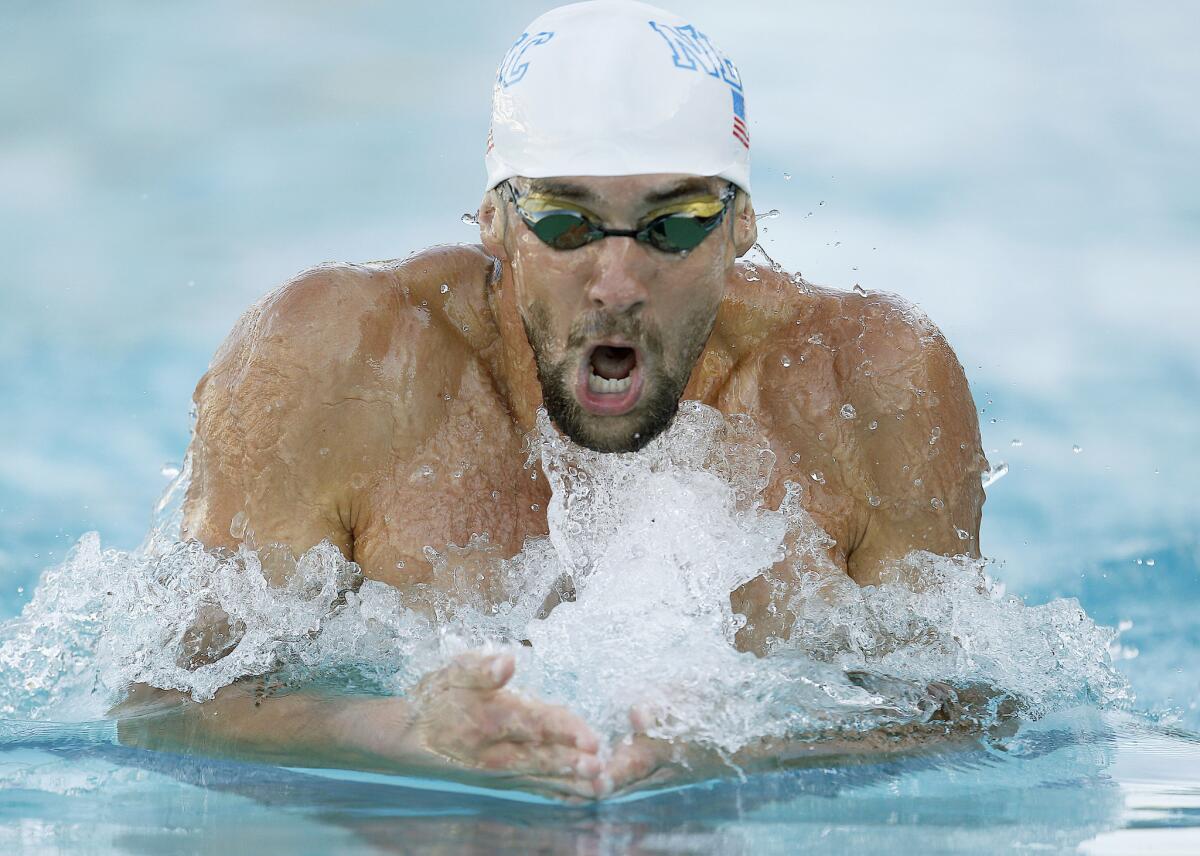 Michael Phelps swims in the 200-meter individual medley final during the Santa Clara International Grand Prix swim meet in Santa Clara.