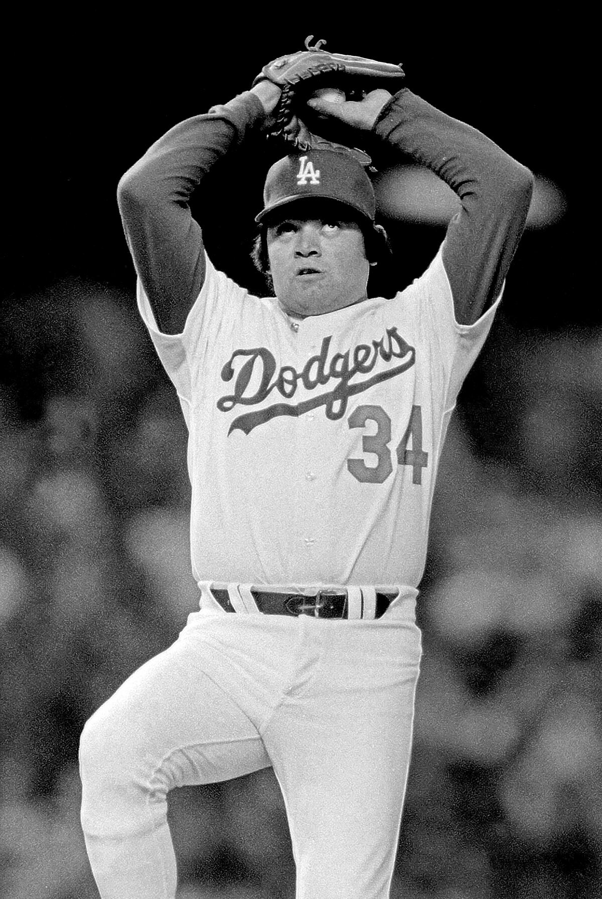 Fernando Valenzuela looks up before delivering a pitch 