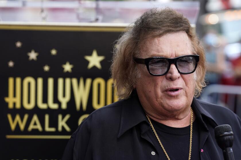Singer/songwriter Don McLean poses during a ceremony to award him a star on the Hollywood Walk of Fame