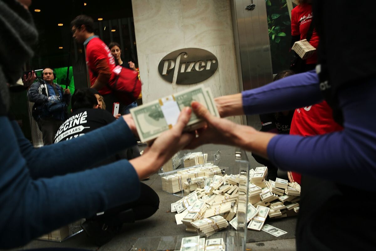 Protesters dumped fake currency outside Pfizer's New York headquarters in 2015 to protest high drug prices