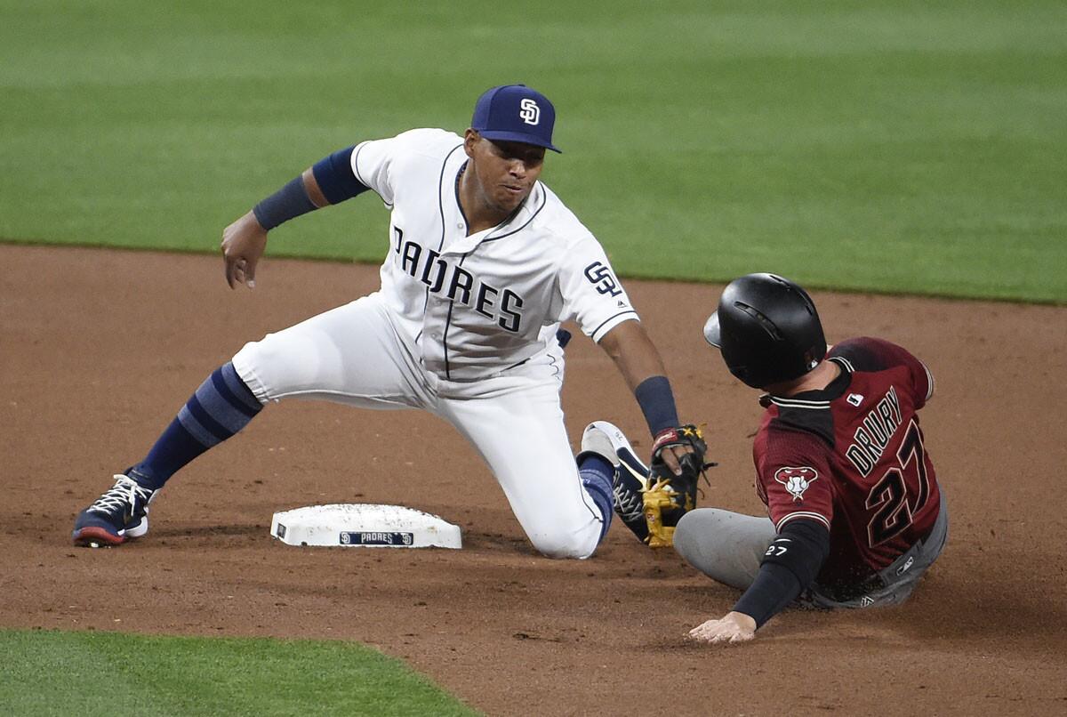 Yangervis Solarte #26 of the San Diego Padres tags out Brandon Drury #27 of the Arizona Diamondbacks as he tries to steal second base during the second inning of a baseball game at PETCO Park on April 19, 2017. (Denis Poroy/Getty Images)