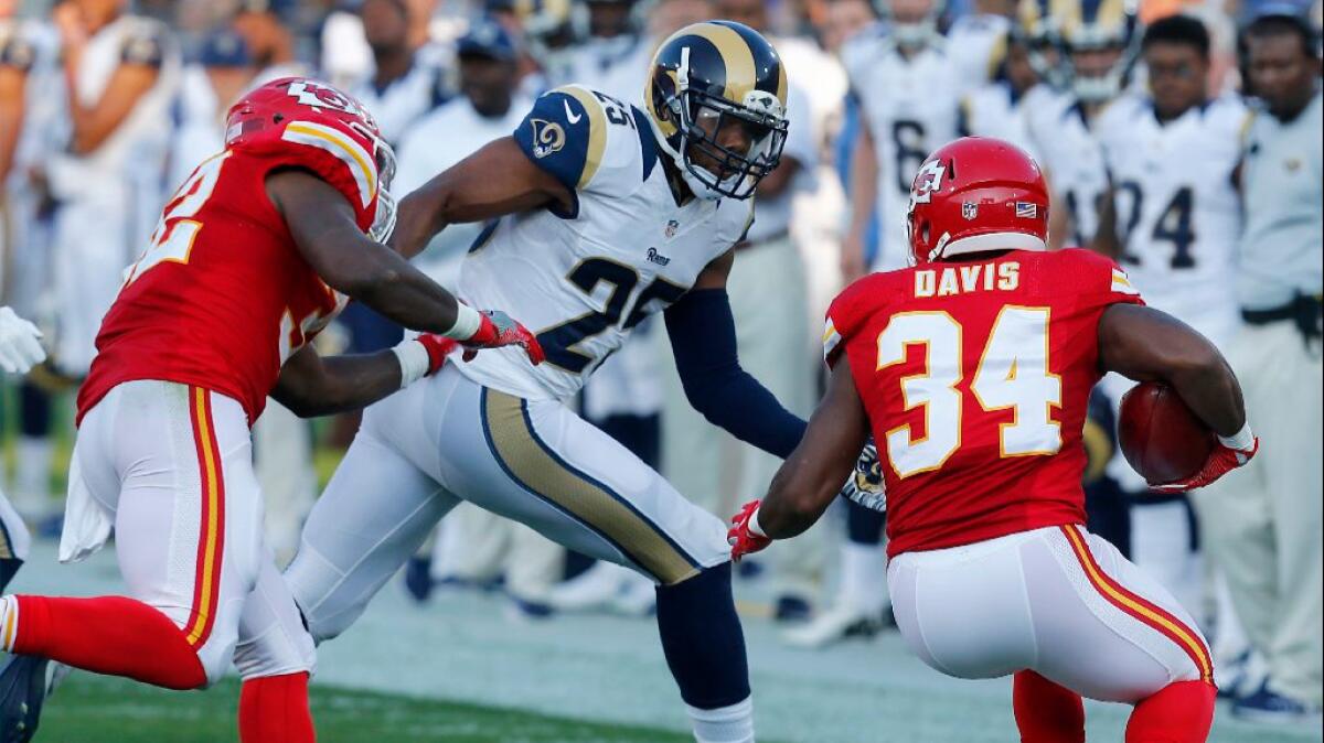 Rams safety T.J. McDonald looks to tackle Chiefs running back Knile Davis during an exhibition game on Aug. 20.