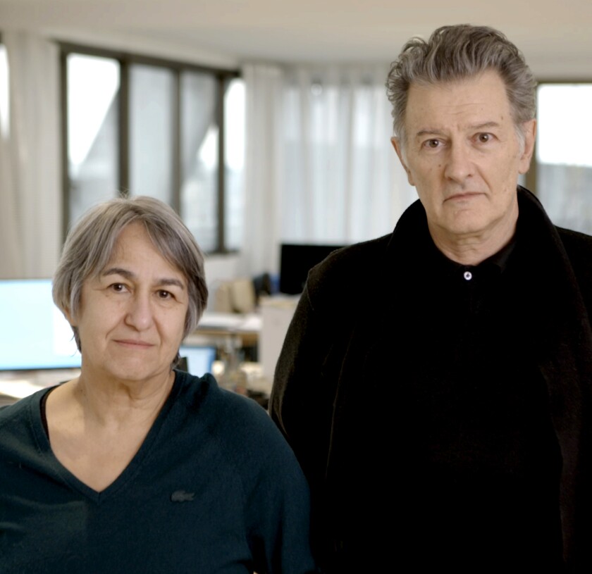 Architects Anne Lacaton and Jean-Philippe Vassal stand shoulder to shoulder in their studio