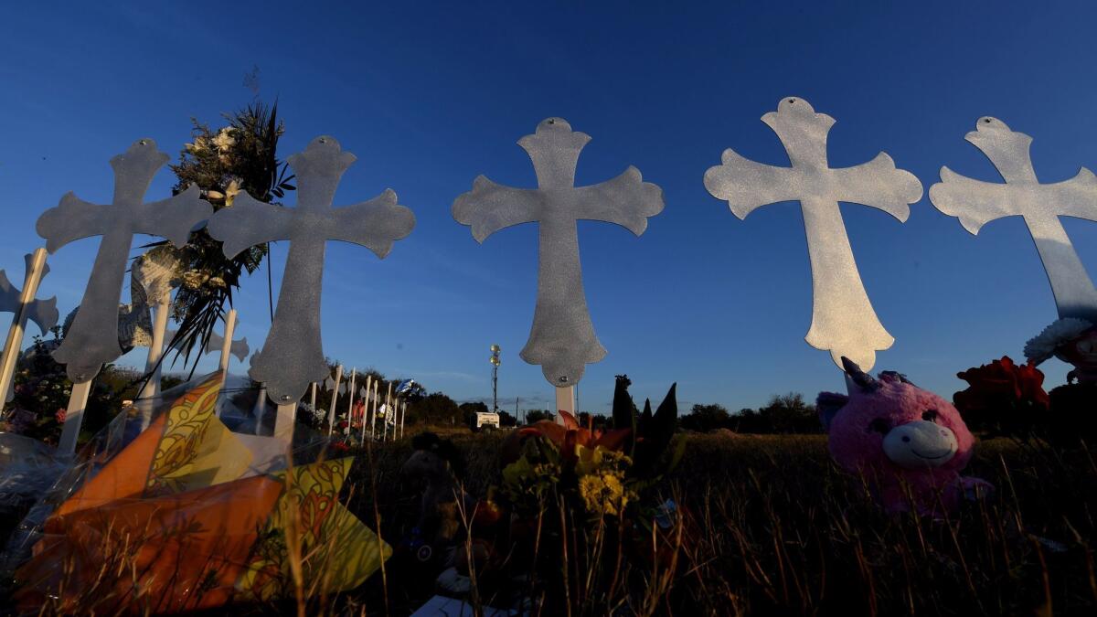 Memorial crosses stand in Sutherland Springs, Texas, to honor the people killed in the mass shooting at a church Sunday.