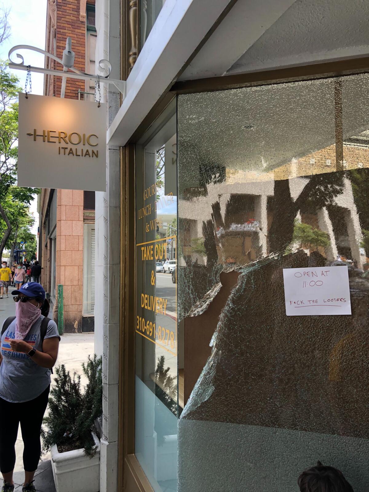 Heroic Deli in Santa Monica opens despite damage to its front window. 