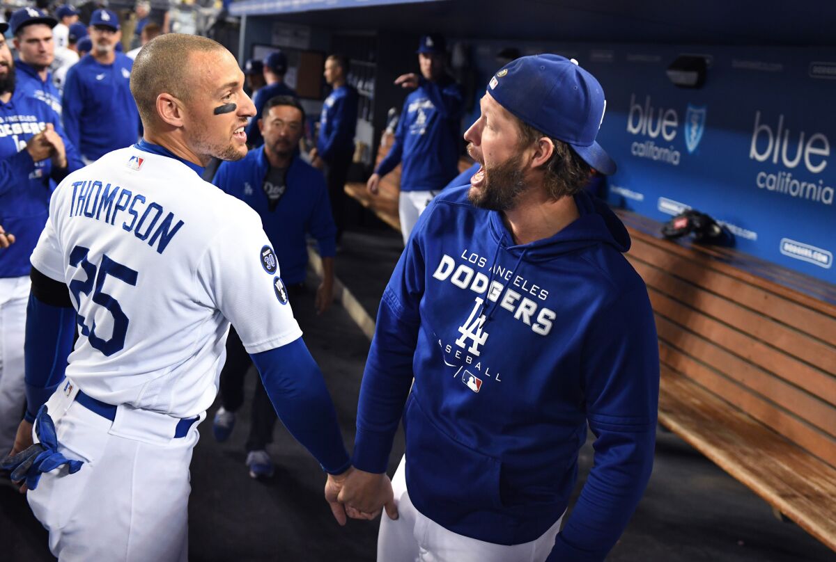 Dodgers outfielder Trayce Thompson, left, celebrates with pitcher Clayton Kershaw.