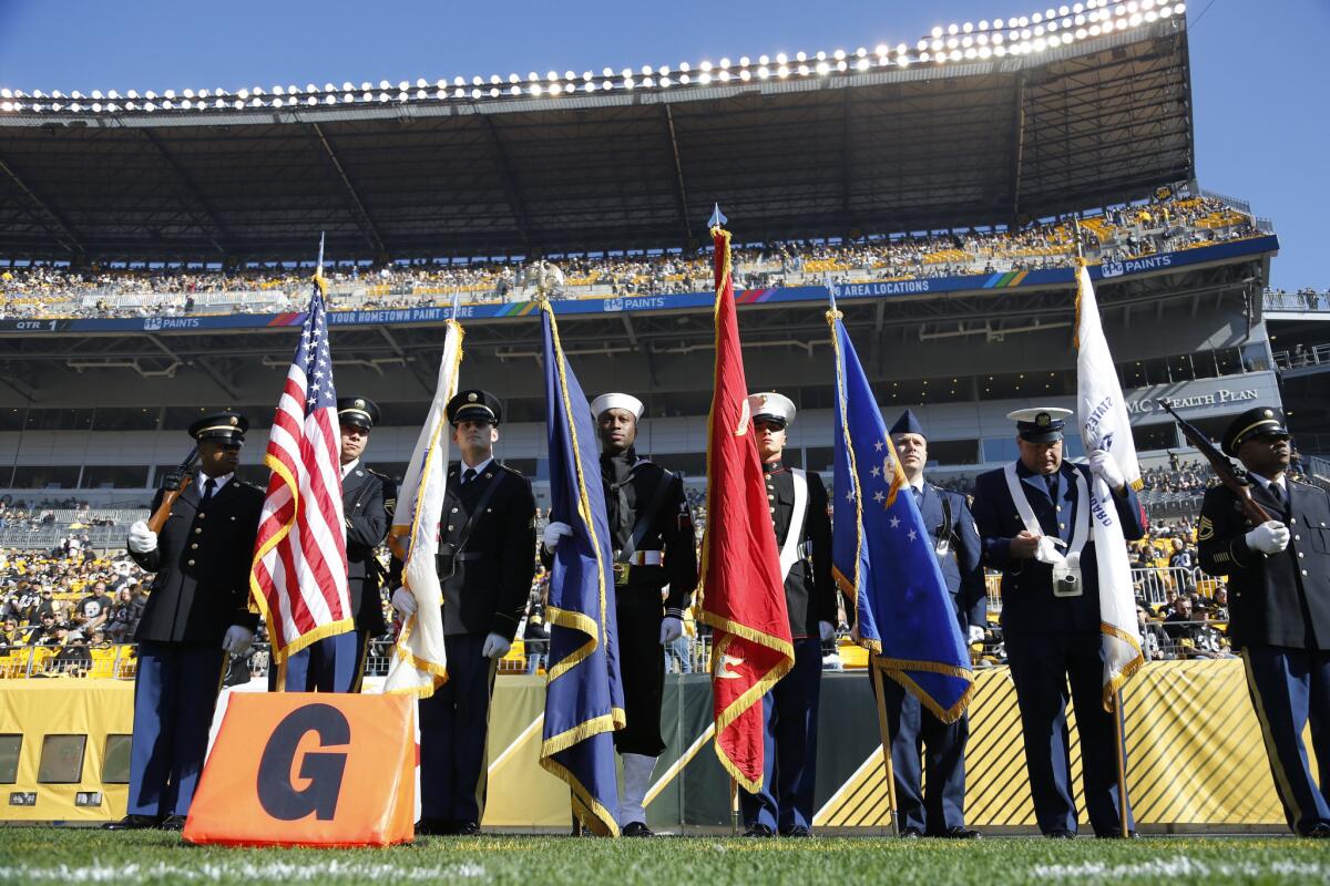 Local members of the armed forces participate as the color guard before the start of an NFL game between the Pittsburgh Steelers and the Oakland Raiders on Nov. 8.