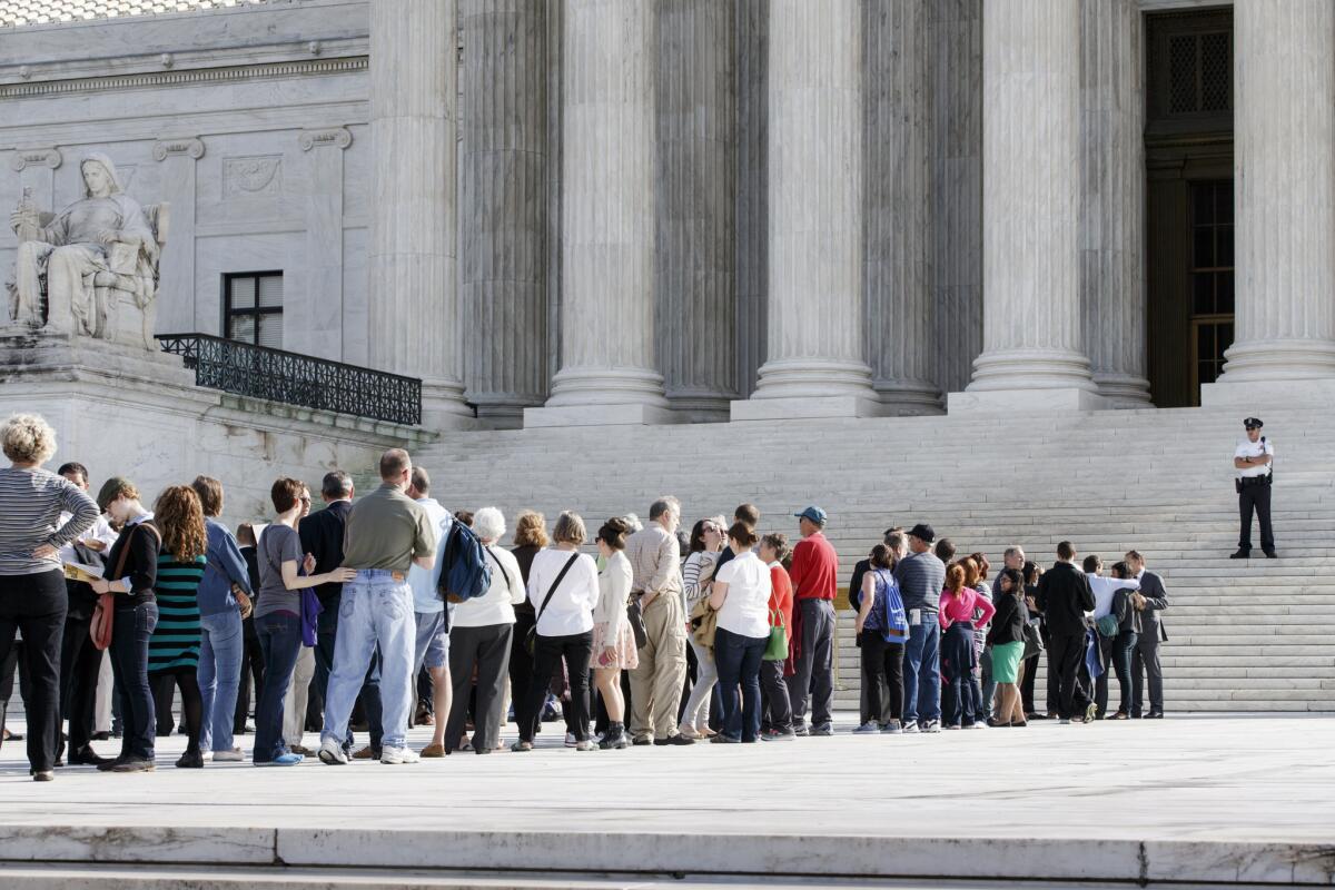 Visitors line up to enter the Supreme Court in Washington last year. High court justices Friday are deciding whether to take up same-sex marriage appeals.