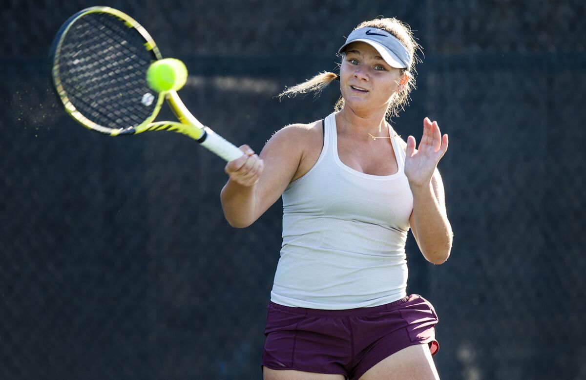 Laguna Beach High freshman  Jessica MacCallum is shown practicing at the Racquet Club of Irvine on Tuesday.