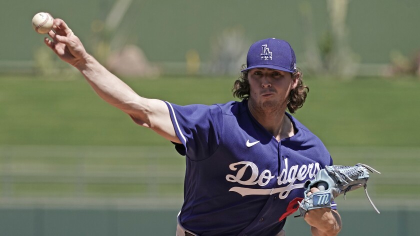 Dodgers pitcher Ryan Pepiot throws during a spring training game against the Texas Rangers.
