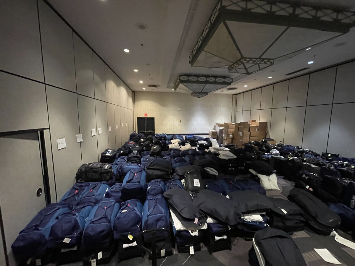 Luggage belonging to members of the U.S. Olympic team waits to be shipped to Beijing ahead of the Winter Olympics.