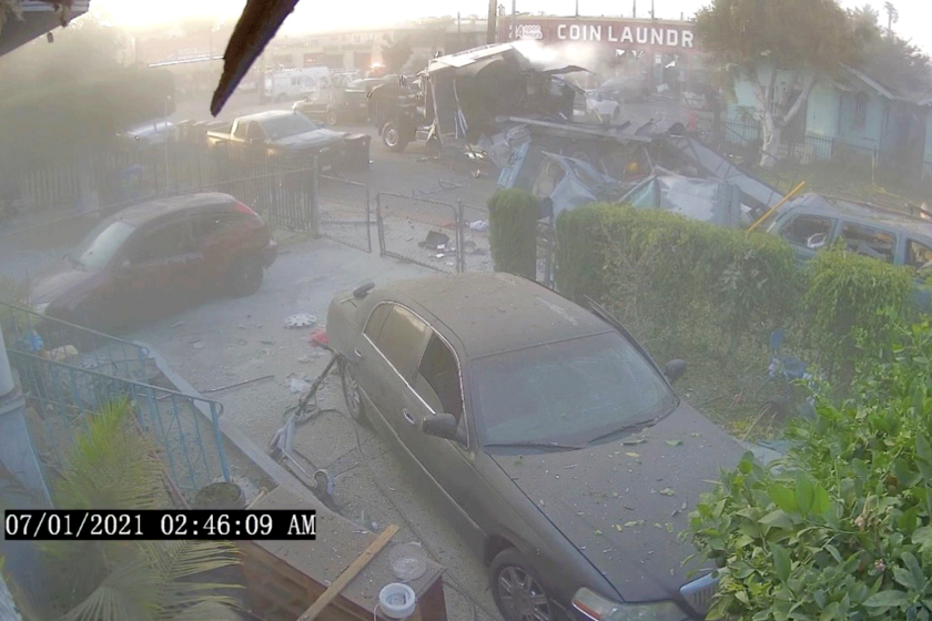Still image from footage that captured a fireworks explosion, showing broken cars and debris