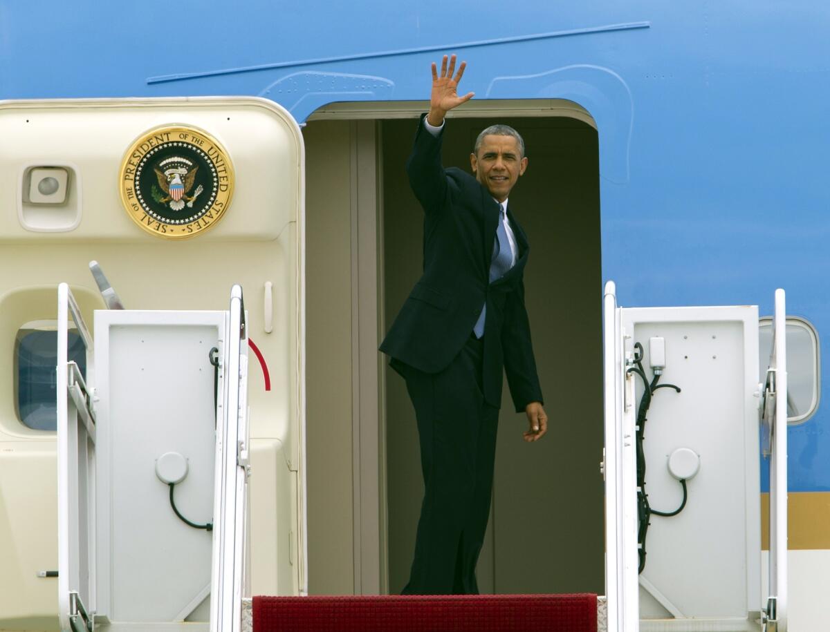 President Obama waves from Air Force One before departure at Andrews Air Force Base in Maryland. He was flying to Seattle for a three-day West Coast trip and will attend at least five fundraising events in Seattle, San Francisco and Los Angeles.