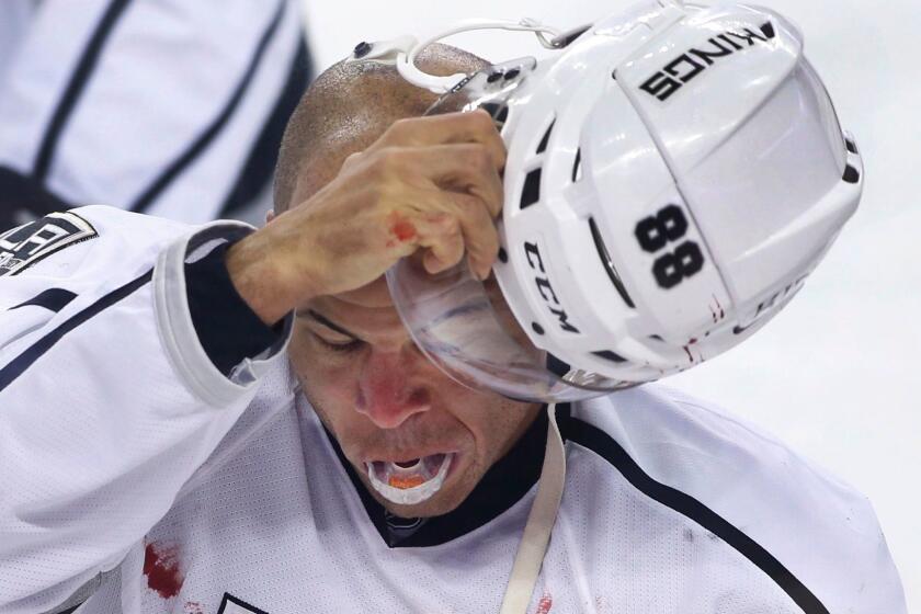 Los Angeles Kings' Jarome Iginla goes to the penalty box after a fight with Calgary Flames' Deryk Engelland during the first period of an NHL hockey game in Calgary, Alberta, Wednesday, March 29, 2017. (Larry MacDougal/The Canadian Press via AP)