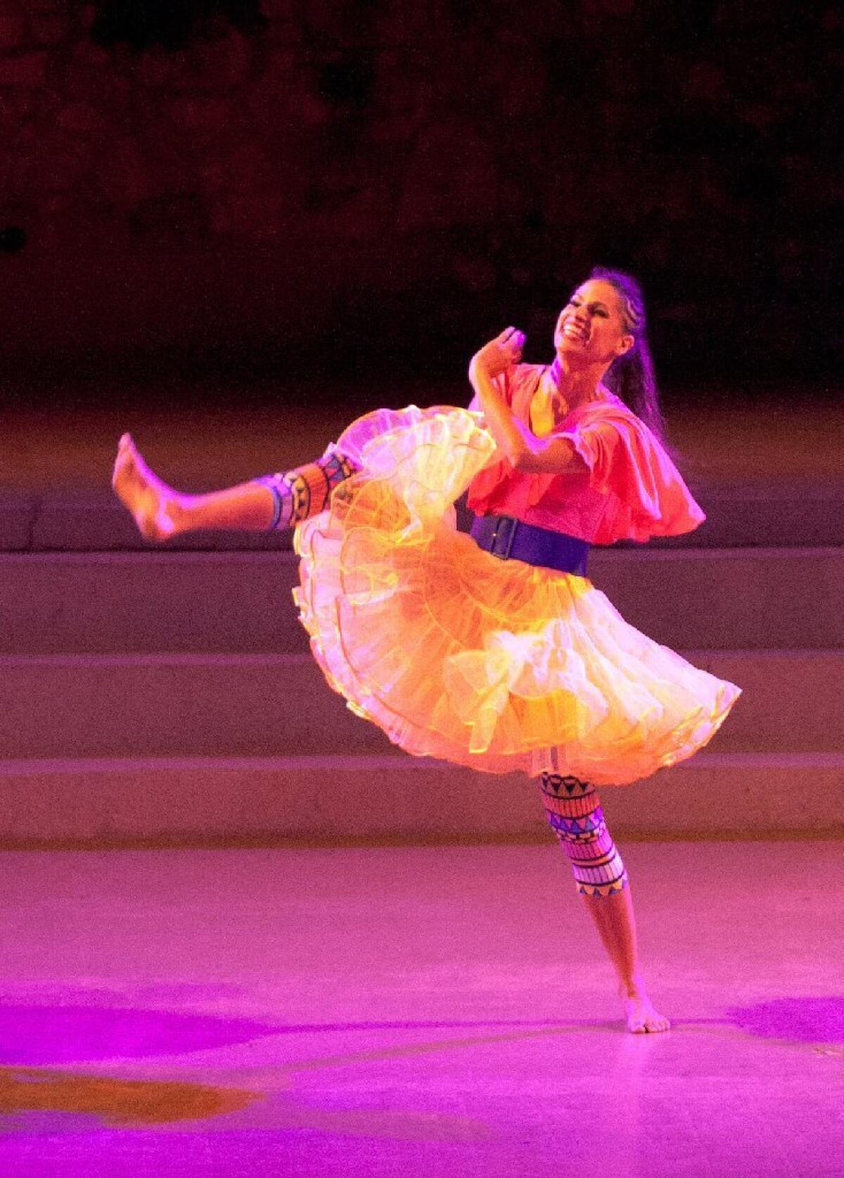 Rachel Hernandez of the Viver Brasil dance troupe performs "Para Xaxa" during a dress rehearsal at the Ford Amphitheatre.