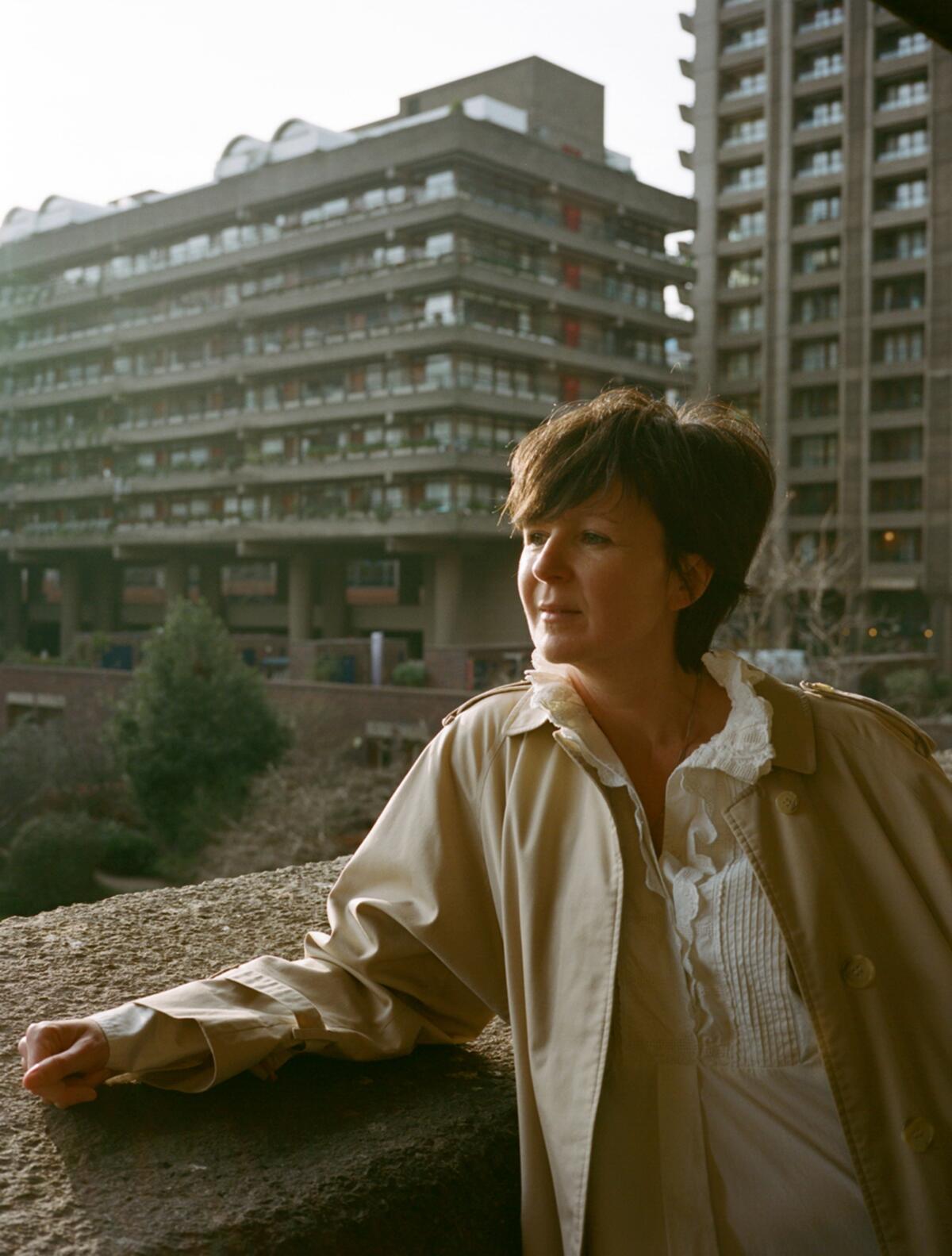 Author Olivia Laing in front of some buildings. 