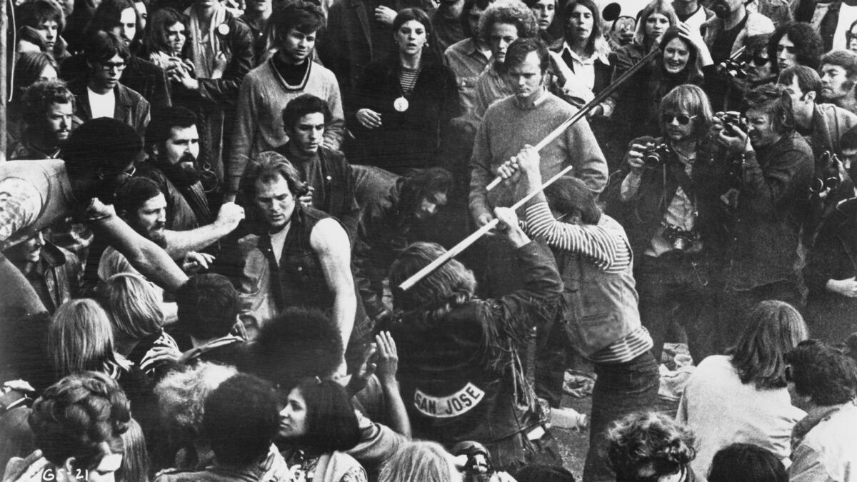 A still from the documentary "Gimme Shelter" shows the audience looking on as Hells Angels beat a fan with pool cues at the Altamont Free Concert in Northern California on Dec. 6, 1969.