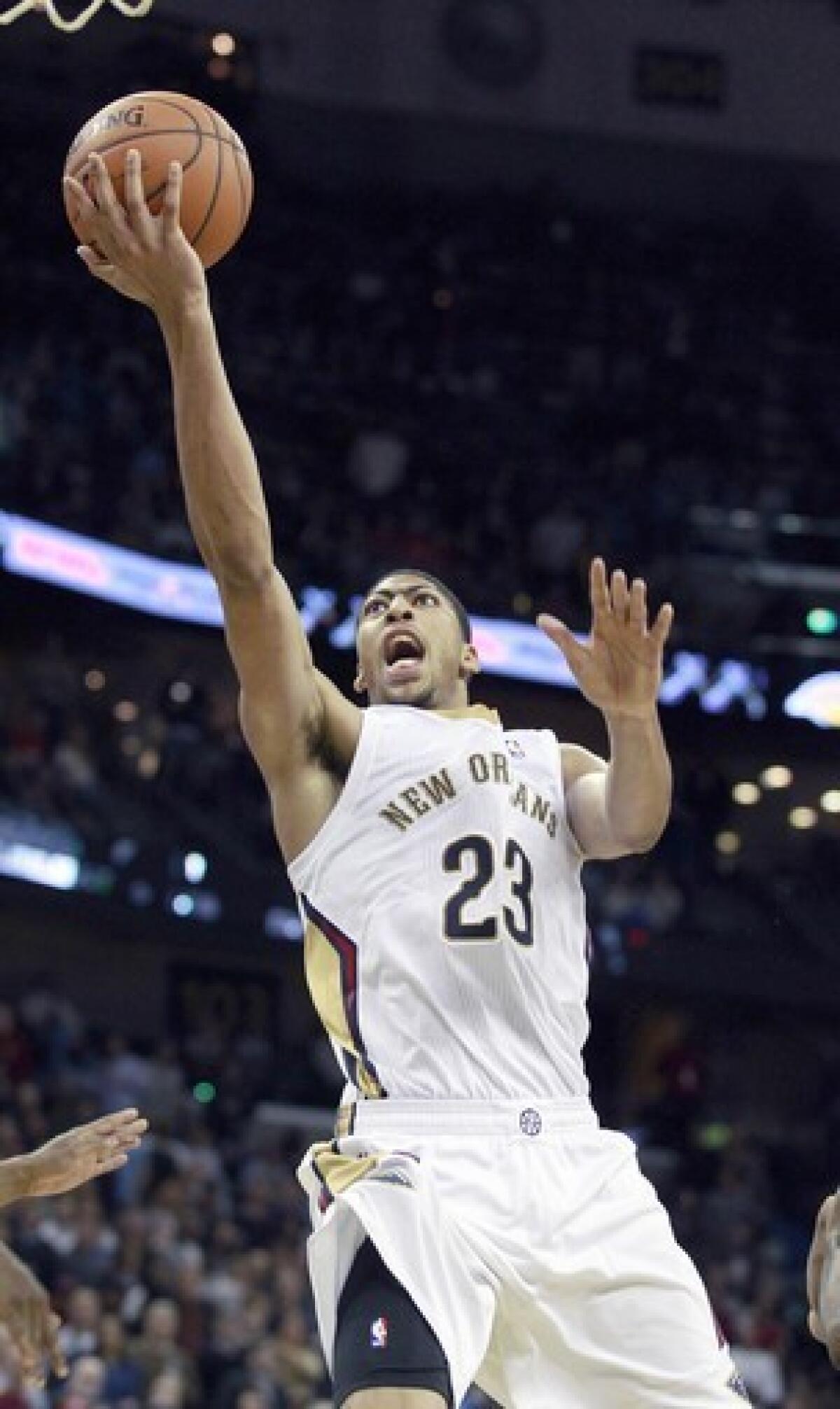 New Orleans Pelicans forward Anthony Davis, scoring against the Lakers in a November 2013 game, will take Kobe Bryant's place on the Western Conference All-Star team.