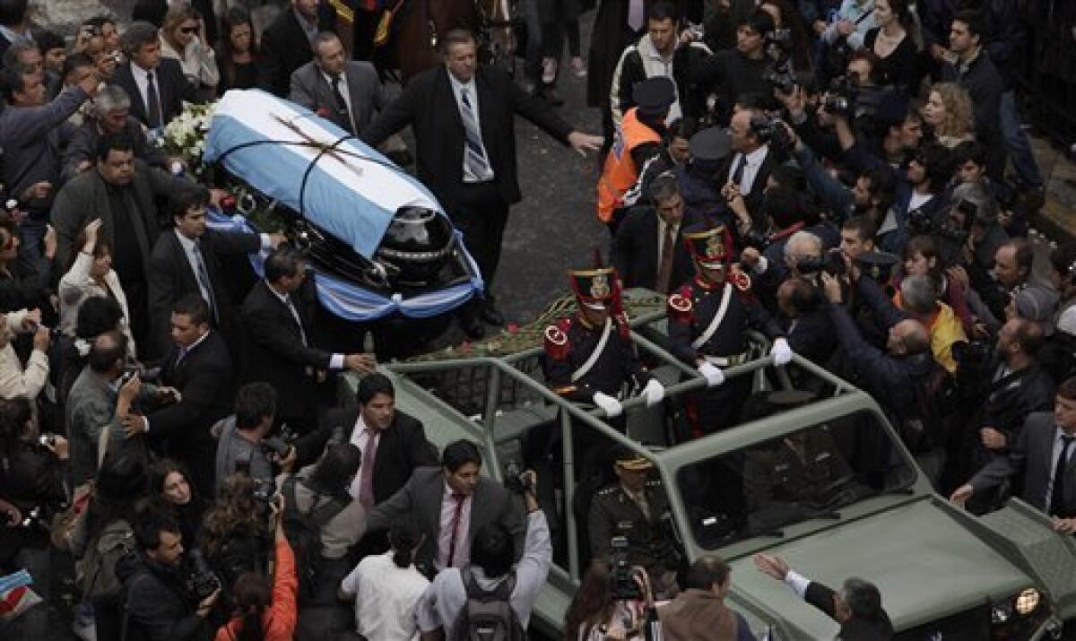 The coffin containing the remains of former Argentina's President Raul Alfonsin is carried on a gun carriage during his funeral in Buenos Aires, Thursday, April 2, 2009. Alfonsin, the first democratically elected president following the 1976-1983 military dictatorship, died at age 82 Tuesday after suffering from lung cancer.(AP Photo/Natacha Pisarenko)