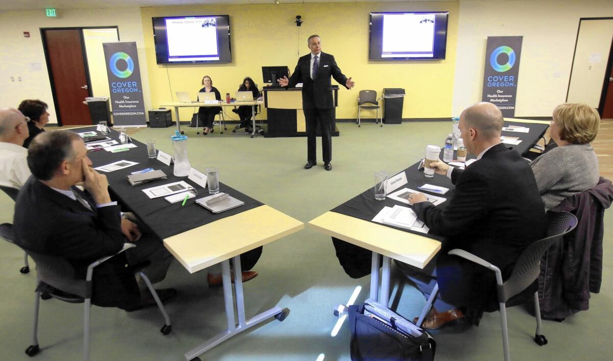 Oregon officials will vote Friday on whether to scrap their troubled state healthcare enrollment exchange and use the federal system instead. Above, Alex Pettit addresses an advisory committee meeting.