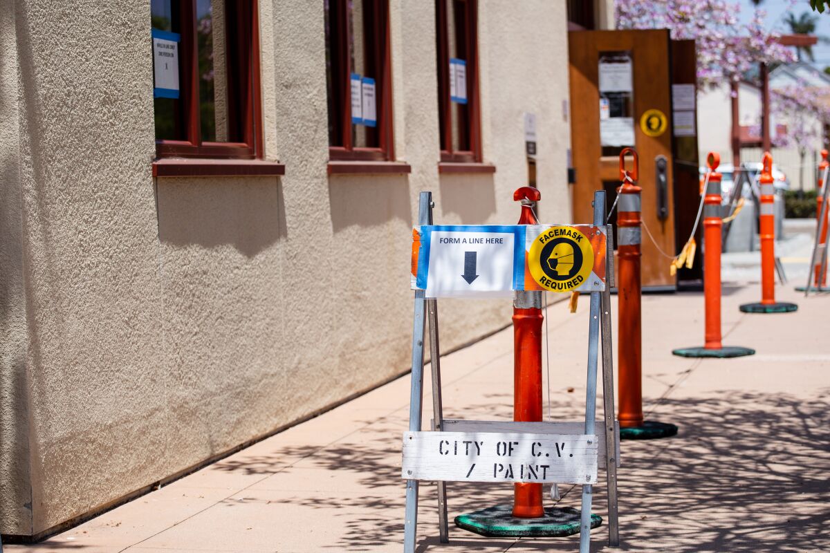 Signs following COVID-19 protocols at the entrance of the Finance Department at Chula Vista City Hall May 19.