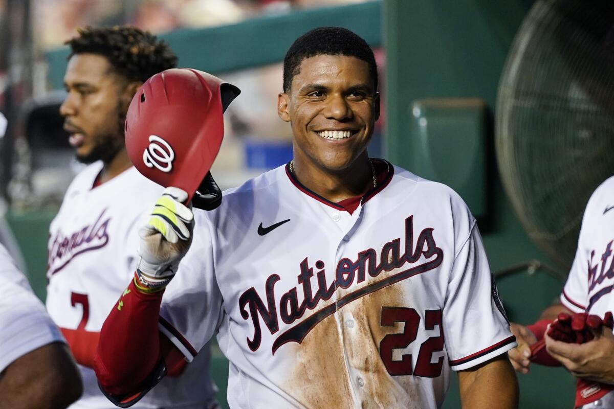 Washington Nationals star Juan Soto smiles after hitting a solo home run against the New York Mets.