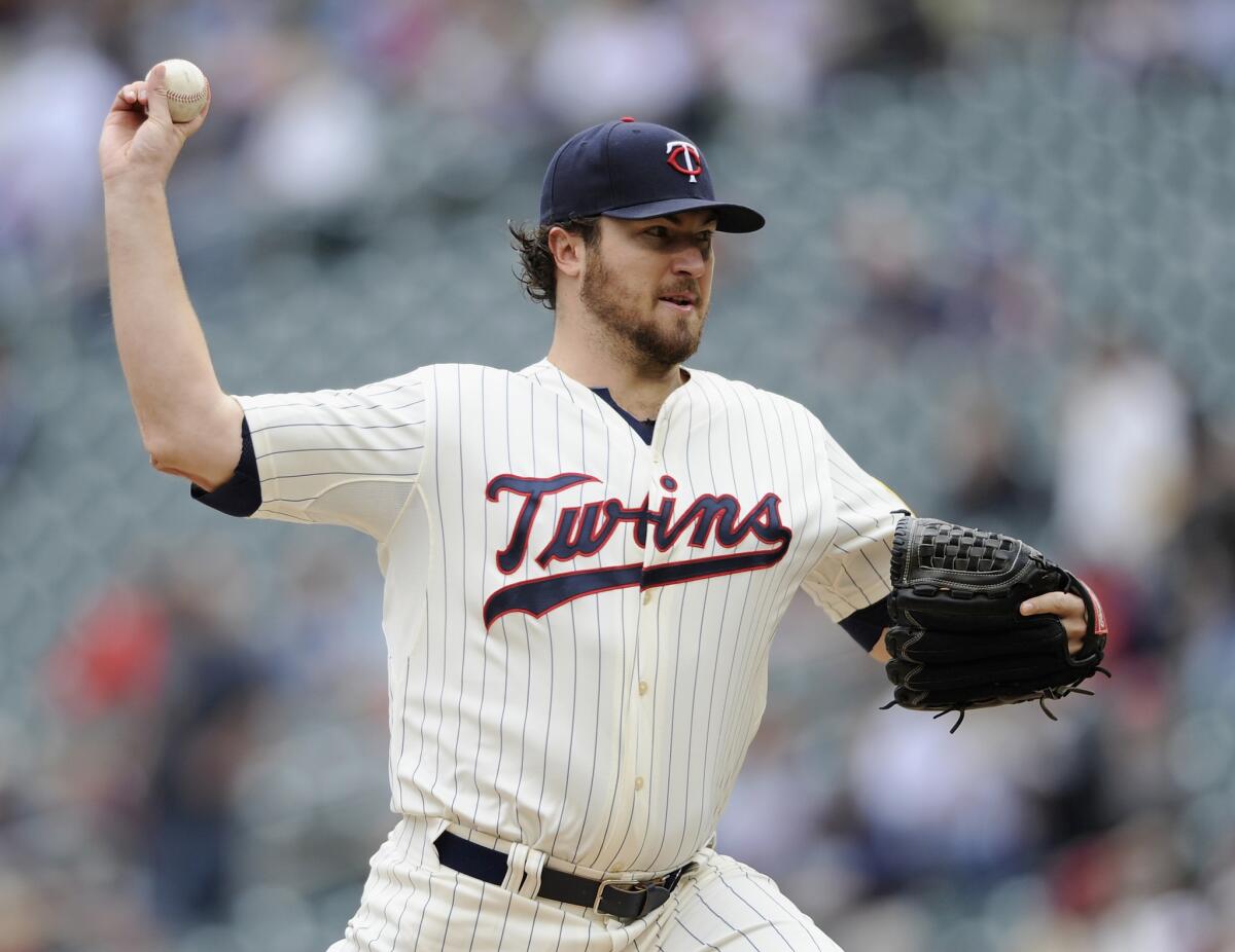 Phil Hughes of the Minnesota Twins delivers a pitch against the Arizona Diamondbacks during the first inning Wednesday.