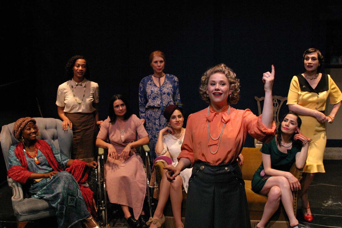 Tiffany Colein with a group of women seated behind her in "Fefu and Her Friends" at the Odyssey. 