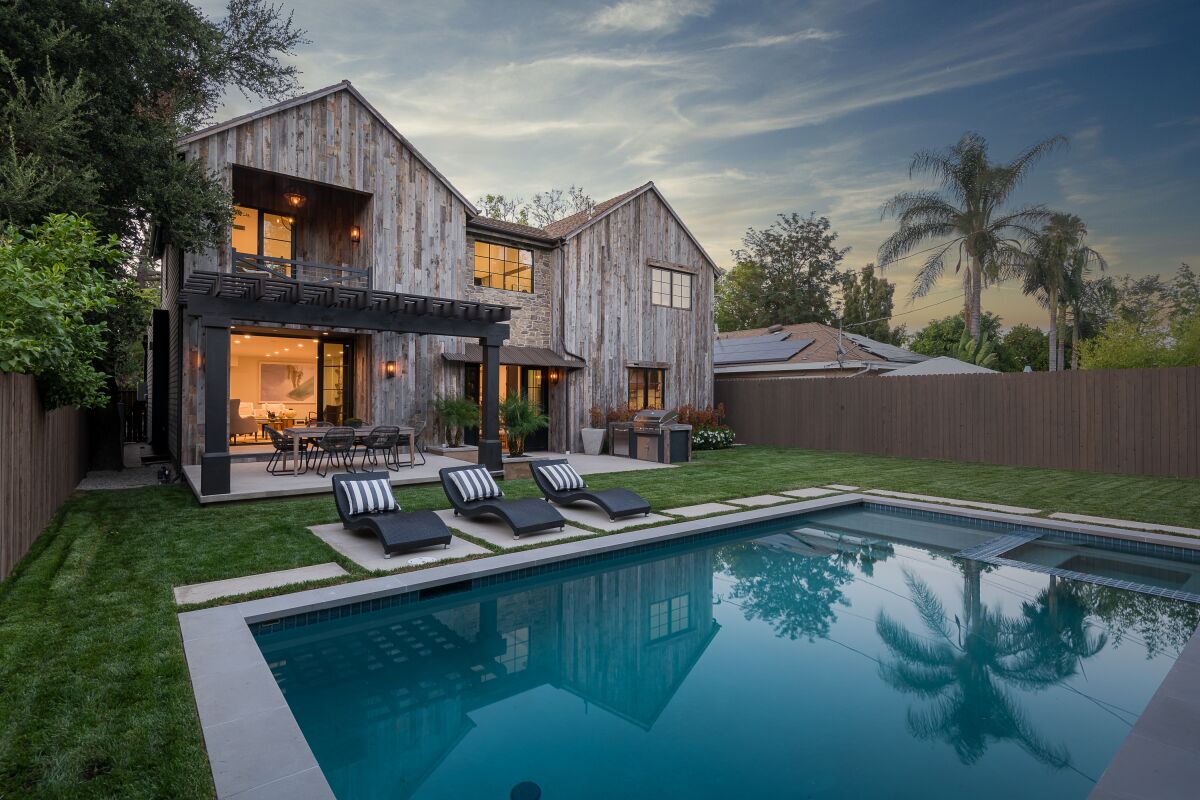 The Valley Village home of Alycia Lane Joseph, redesigned in rustic farmhouse style, has a backyard pool.