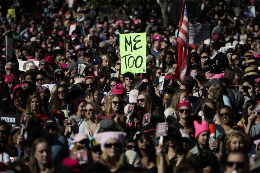 FILE - In this Saturday, Jan. 20, 2018 file photo, protesters gather at the Grand Park in Los Angeles for a Women's March against sexual violence and the policies of the Trump administration. The #MeToo movement, which surfaced late in 2017, maintained its momentum throughout 2018 as many more powerful men were forced to account for past instances of sexual assault and misconduct. (AP Photo/Jae C. Hong)