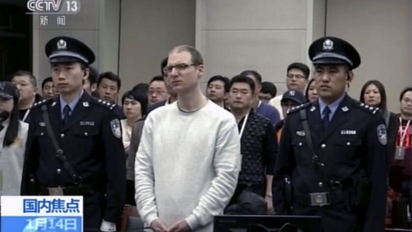 In this image taken from video run by China's CCTV, Canadian Robert Lloyd Schellenberg attends his retrial at the Dalian Intermediate People's Court in China's Liaoning province on Monday.