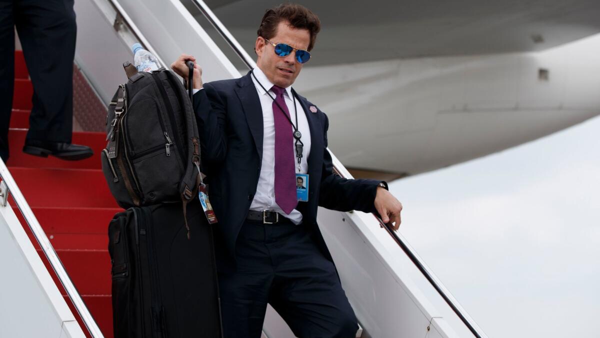 White House communications director Anthony Scaramucci walks down the steps of Air Force One after arriving in Ronkonkoma, N.Y., on July 28.