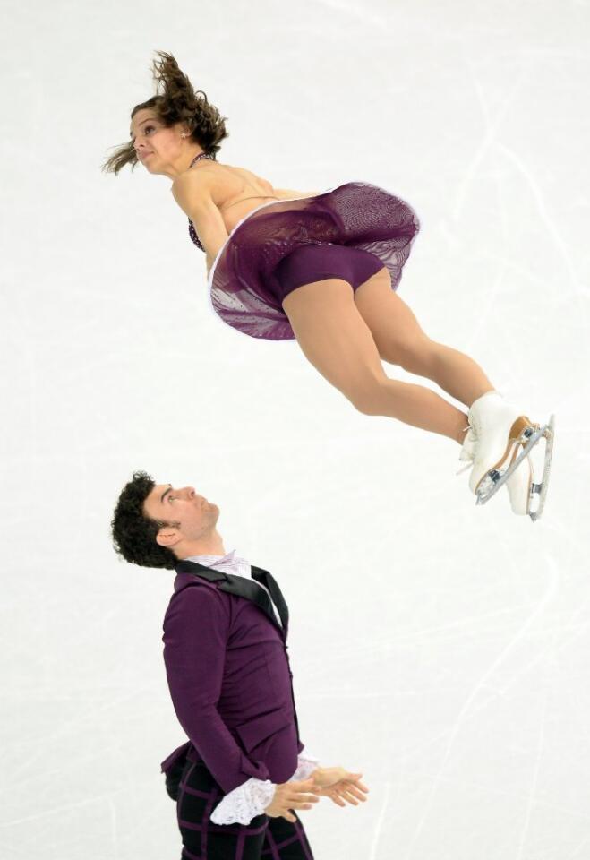 We love Canadian Meagan Duhamel's midair hairdo during the pairs free skate. The look on Eric Radford's is pretty good too.