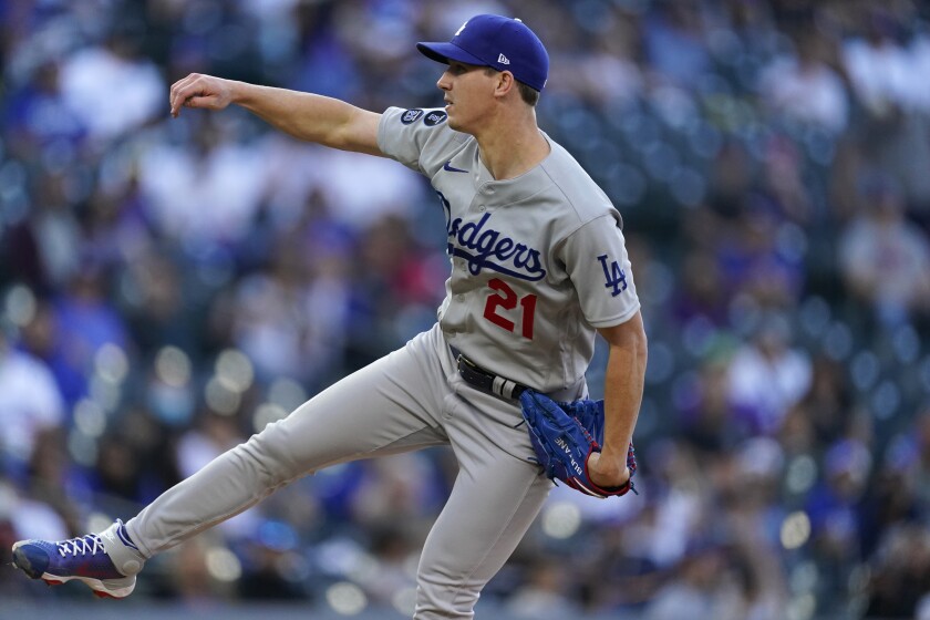 Los Angeles Dodgers starting pitcher Walker Buehler works against the Colorado Rockies in the first inning of a baseball game Saturday, April 3, 2021, in Denver. (AP Photo/David Zalubowski)