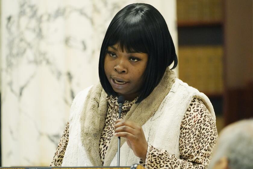 File - Brandy Nichols, a single mother of four children who are 8 and younger, speaks to members of the Mississippi House and Senate Democratic Caucuses, about the difficulty of obtaining Temporary Assistance for Needy Families (TANF) funds in Mississippi, Oct. 18, 2022, in Jackson. Funds from the program designed to help low-income families with children achieve economic self-sufficiency, were misspent and lawmakers are seeking to gain a better understanding of the welfare scandal. (AP Photo/Rogelio V. Solis, File)