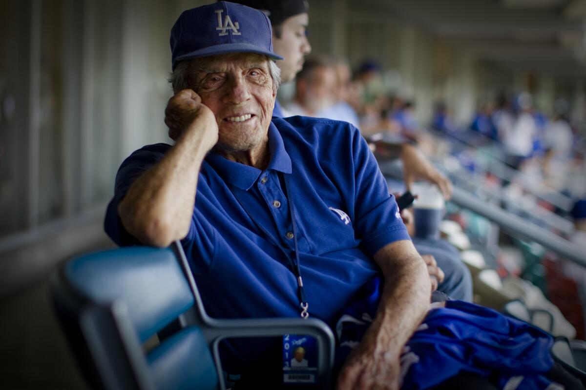 Legendary scout George Genovese, shown at Dodger Stadium in 2013, was hired by the Dodgers after the San Francisco Giants dismissed him in 1994.